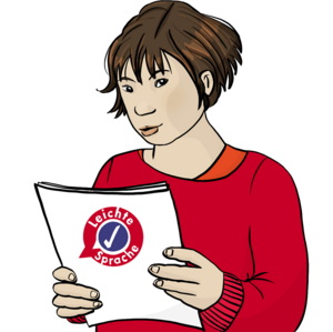 Eine Frau hält ein Heft mit dem Logo des Netzwerks in der Hand.